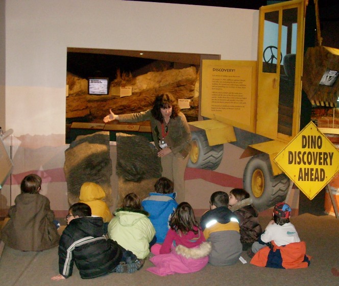 A group of students learn about the trackway
